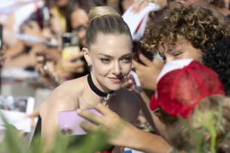 Venice, Italy - 1 September 2025: Amanda Seyfried signing autographs during the Red Carpet of - The
