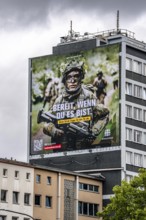 Large-format advertising poster of the German Armed Forces, for recruitment, on a residential