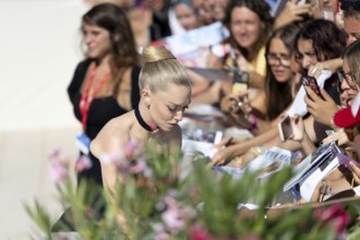 Venice, Italy - 1 September 2025: Amanda Seyfried signing autographs during the Red Carpet of - The