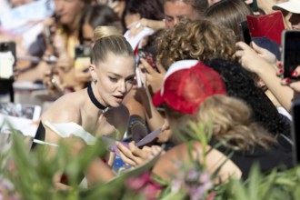 Venice, Italy - 1 September 2025: Amanda Seyfried signing autographs during the Red Carpet of - The