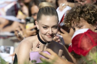 Venice, Italy - 1 September 2025: Amanda Seyfried signing autographs during the Red Carpet of - The