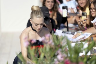 Venice, Italy - 1 September 2025: Amanda Seyfried signing autographs during the Red Carpet of - The