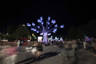 View of Hans-Jochen-Vogel-Platz at the Superbloom Festival at night, day 2 in the Olympic Park,