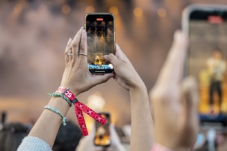 Visitors film the performance of Shawn Mendes at the Superbloom Festival, Day 2 at the Olympiapark,