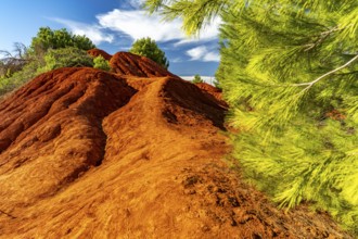 Red rocks in the landscape at Cava di Bauxite, Otranto, Apulia, Italy