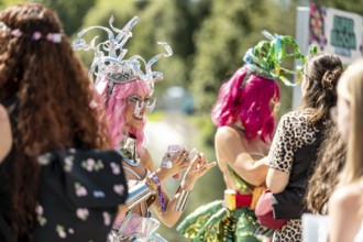 Festival visitors are made up with glitter at the Superbloom Festival, Day 2 in the Olympic Park,