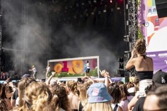 Festival visitors celebrate with the band 01099 at the Superbloom Festival, day 2 in the