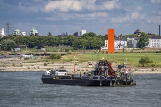 Bucket chain dredger at work on the Rhine near Duisburg, between the Neuenkamper Rhine Bridge and