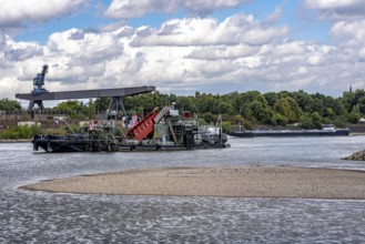 Bucket chain dredger at work on the Rhine near Duisburg, between the Neuenkamper Rhine Bridge and