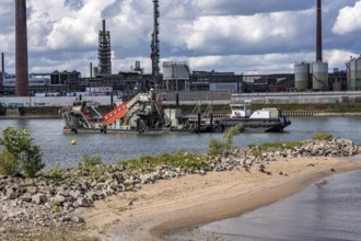 Bucket chain dredger at work on the Rhine near Duisburg, between the Neuenkamper Rhine Bridge and