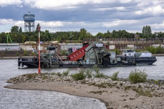 Bucket chain dredger at work on the Rhine near Duisburg, between the Neuenkamper Rhine Bridge and