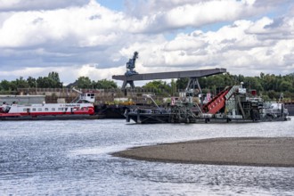 Bucket chain dredger at work on the Rhine near Duisburg, between the Neuenkamper Rhine Bridge and