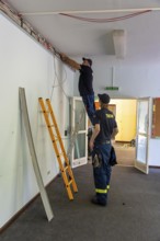 Emergency services from the infrastructure specialist group set up water, sewage, electricity and
