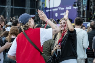 Visitors celebrate during Nelly Furtado's performance at the Superbloom Festival, Day 1 at the