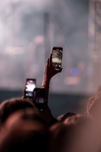 Visitors film Post Malone's performance at the Superbloom Festival, Day 1 at the Olympiapark,