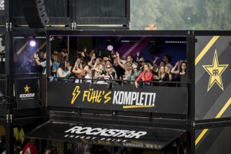 Festival visitors celebrate on the Rockstar Energy Tower at the Superbloom Festival, Day 1 in the
