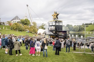 Festival visitors celebrate on the Rockstar Energy Tower at the Superbloom Festival, Day 1 in the