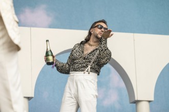 Ralph Stachulla (Keyboarder) of Roy Bianco & Die Abbrunzati Boys with champagne bottle at the