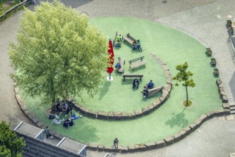 Aerial view, Peace Village International, resting place with benches and shady tree, non-profit