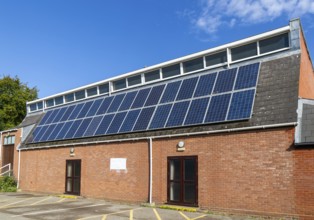 Solar panels on roof of Woodbridge Community Hall, community centre building, Woodbridge, Suffolk,