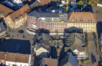 Aerial view, town hall and new building construction site with facade cladding, market place, Olfen
