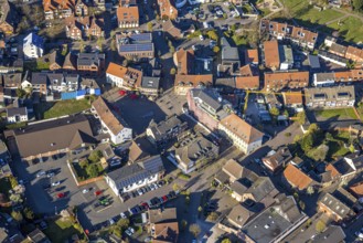 Aerial view, city centre view with town hall and new building site with facade cladding, market