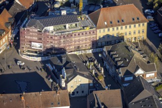 Aerial view, town hall and new building construction site with facade cladding, market place, Olfen