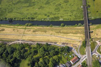 Aerial view, Ruhr river and Ruhr valley with railway bridge, construction site Am Ruhrufer and