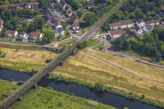 Aerial view, Ruhr river and Ruhr valley with railway bridge, construction site Am Ruhrufer and