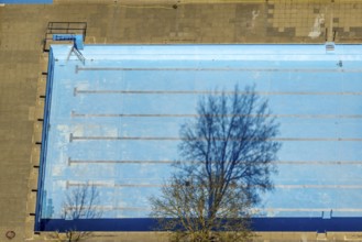 Aerial view, outdoor and indoor swimming pool, tree reflected in the pool, Meschede town, Meschede,