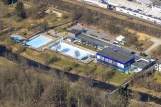 Aerial view, outdoor and indoor swimming pool, tree reflected in the pool, Meschede town, Meschede,