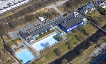 Aerial view, outdoor and indoor swimming pool, tree reflected in the pool, Meschede town, Meschede,