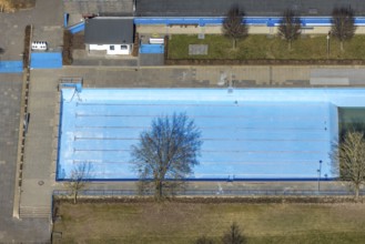 Aerial view, outdoor and indoor swimming pool, tree reflected in the pool, Meschede town, Meschede,