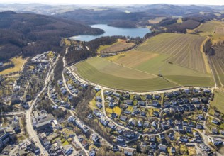 Aerial view, Hennesee dam with wooded area and hilly landscape, meadows and fields with residential