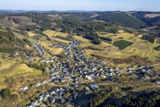 Aerial view, residential area town centre with St. Katharina Catholic Church, wooded area hilly