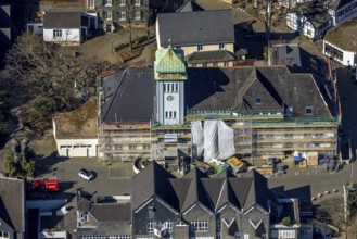 Aerial view, town hall in the old town centre construction site with renovation and covered house