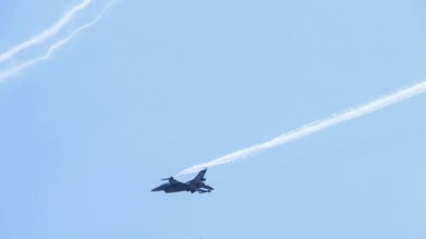 Turkish Air Force helicopters and fighter jets perform aerobatic maneuvers during Teknofest