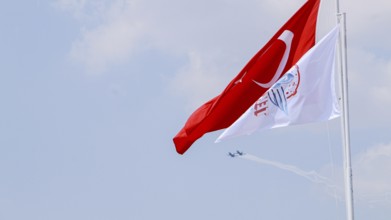 Turkish Air Force helicopters and fighter jets perform aerobatic maneuvers during Teknofest