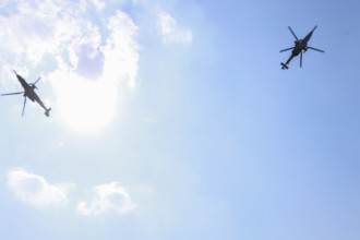 Turkish Air Force helicopters and fighter jets perform aerobatic maneuvers during Teknofest