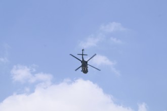 Turkish Air Force helicopters and fighter jets perform aerobatic maneuvers during Teknofest