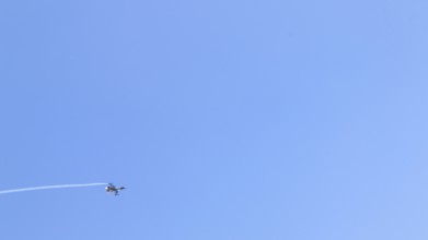 Turkish Air Force helicopters and fighter jets perform aerobatic maneuvers during Teknofest