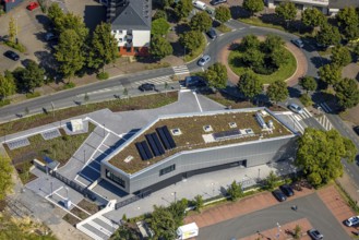 Aerial view, new integration house / health centre with café at the neighbourhood square in the