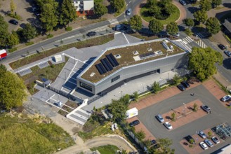Aerial view, new integration house / health centre with café at the neighbourhood square in the