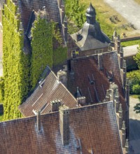 Aerial photo, storks and their nests on the roof of Heessen Castle, stork droppings on the roof,