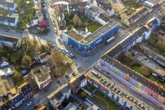 Aerial view, residential area and construction site with new residential building on the corner of