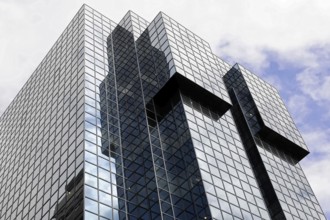 London, England, Great Britain, Modern building with mirrored glass façade and cloud reflections,