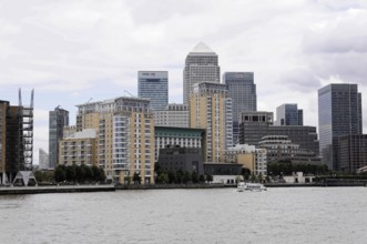 London, England, Great Britain, Europe, Skyline of a modern city with skyscrapers on the riverbank