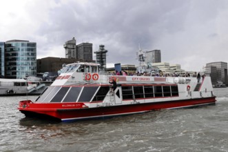 London, England, Great Britain, Europe, City tour boat sailing on a river in a modern environment