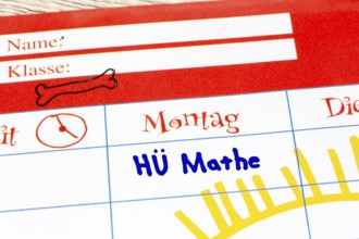 (Photomontage) Close-up of a timetable with added text HÜ MATHE