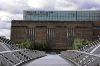 The modern building of the Tate Modern Museum under a cloudy sky, London, England, Great Britain